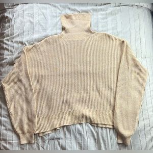 Urban Outfitters Cream knit turtleneck sweater. Slit in the side. 60% cotton.